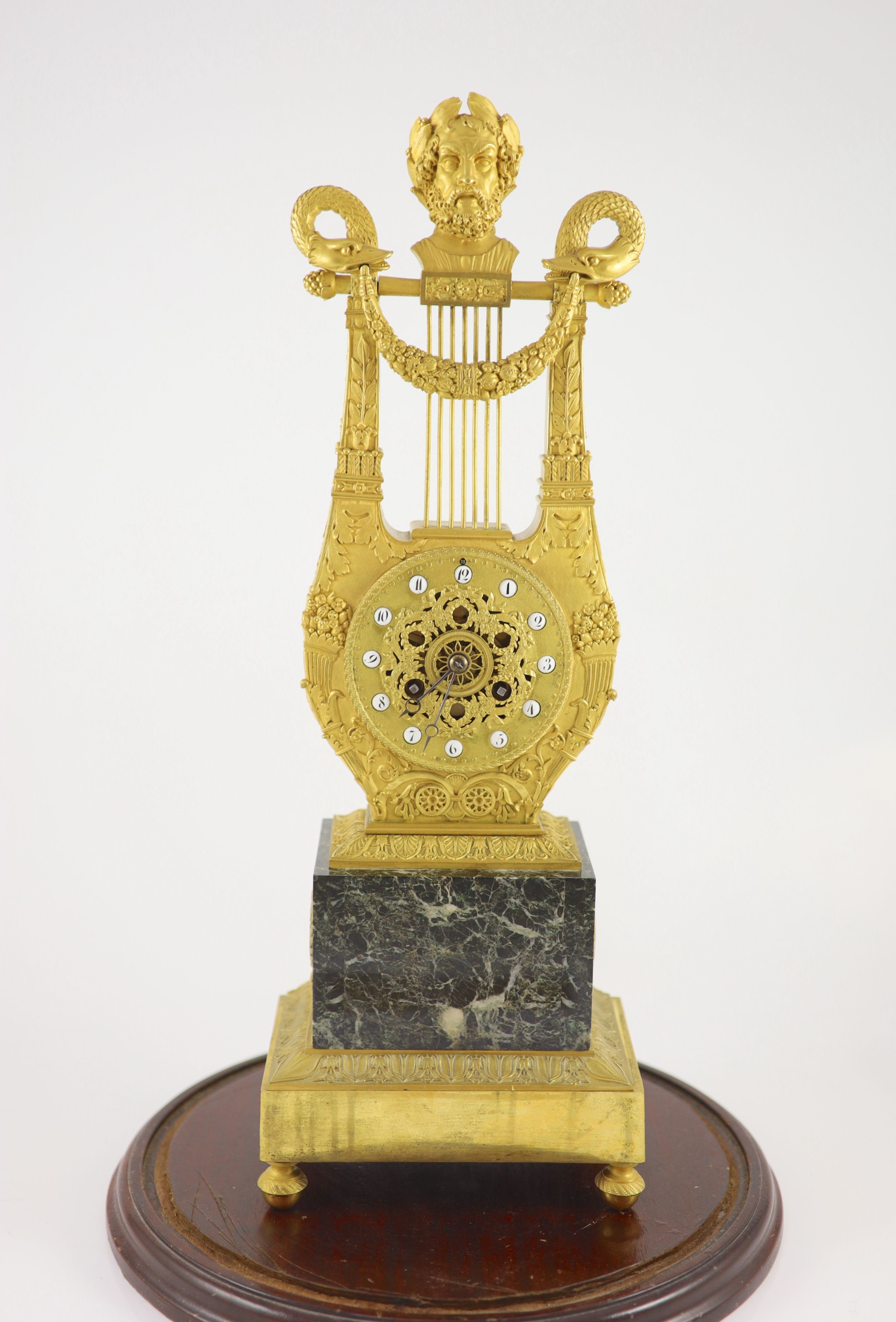 A 19th-century French ormolu and marble lyre shaped mantel clock H 52cm. W 18cm. D 12cm.